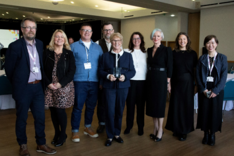 Alison Wright (middle) accepting an award on behalf of the Eric Wright Charitable Trust.